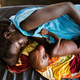 A mother with her child at the clinic run by Doctors Without Borders in Aweil, northern Bahr al-Ghazal, South Sudan, on Oct. 11, 2016 (Albert Gonzalez Farran/AFP/Getty Images)